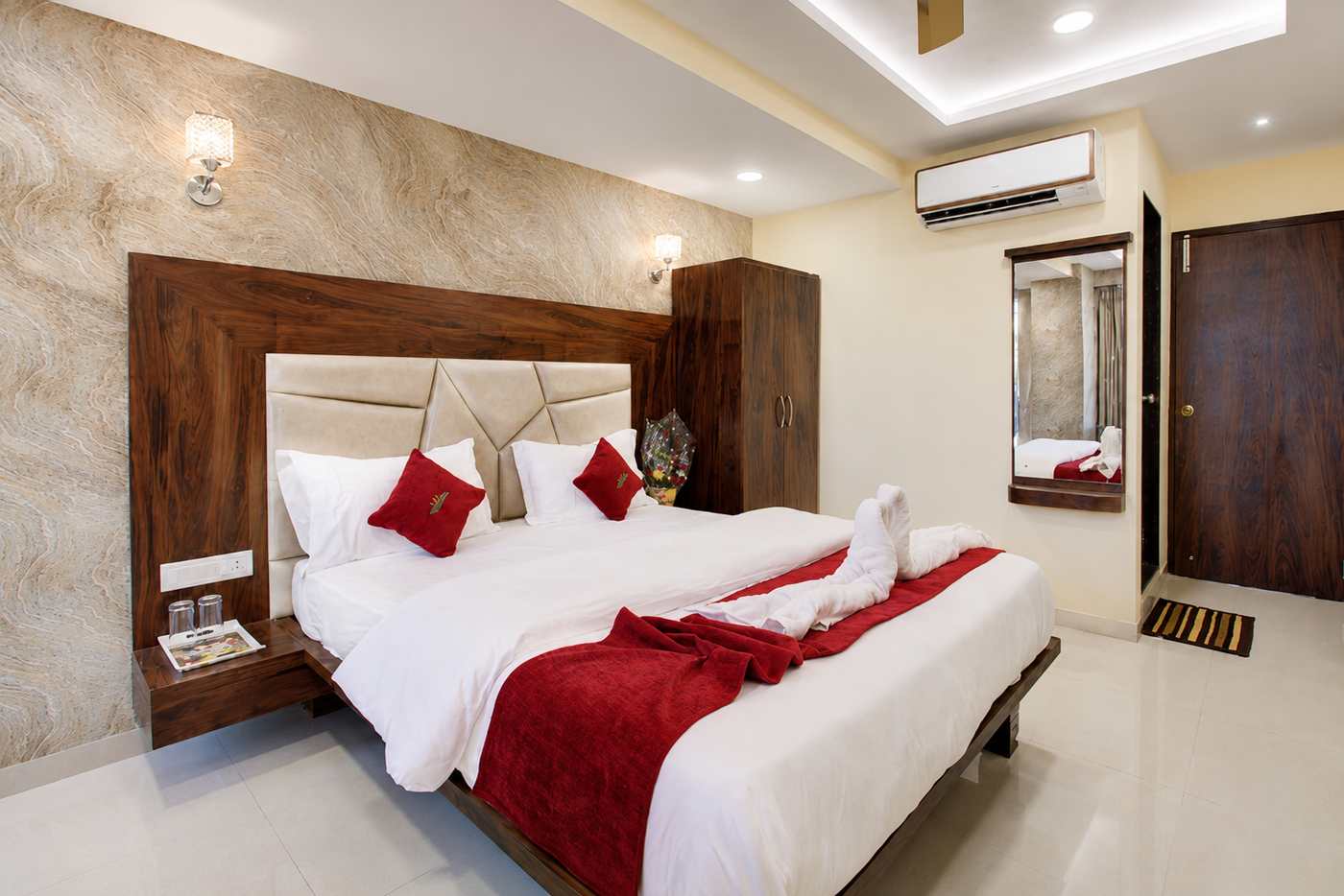 A prepared double room with fresh linens at Hotel Samaira Residency